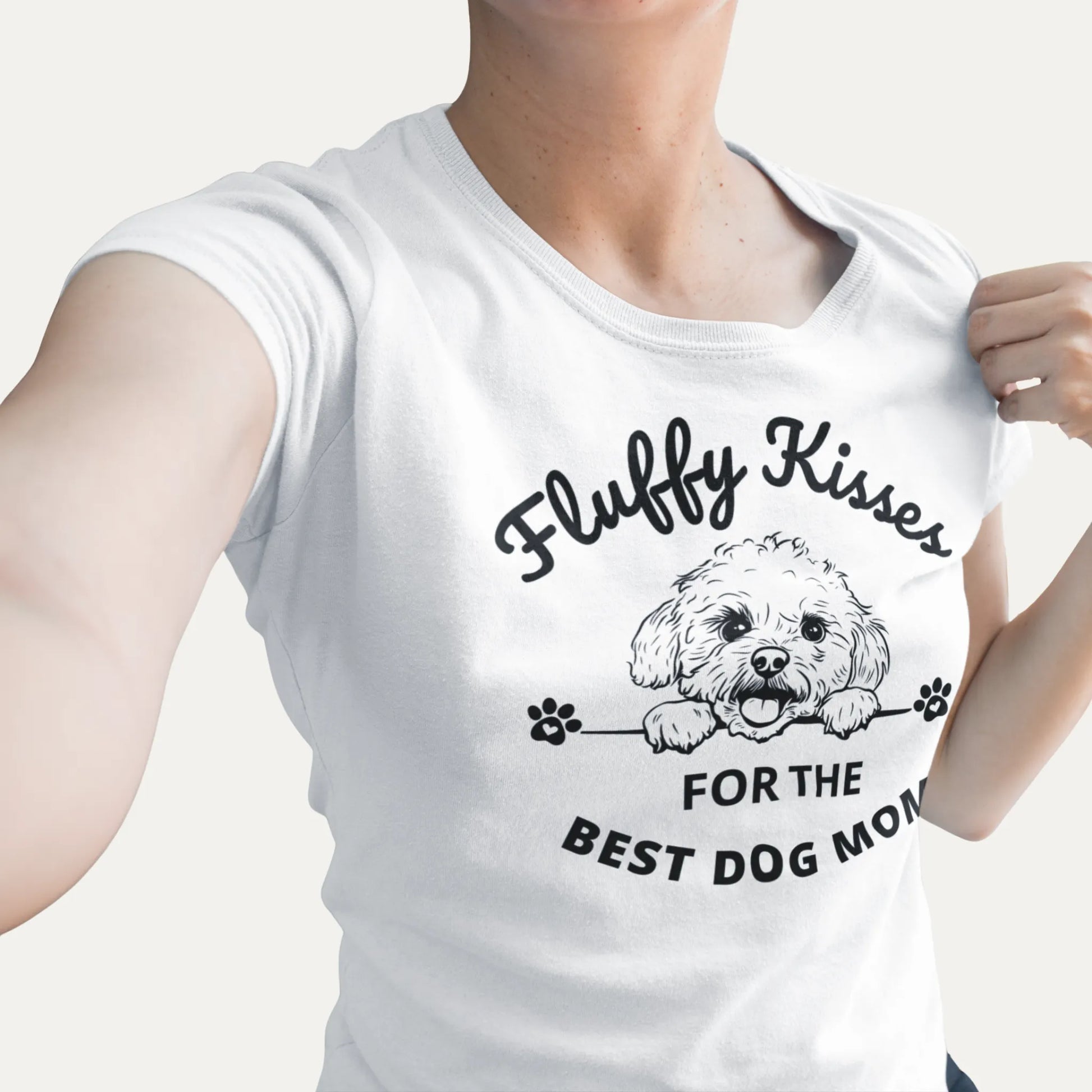 Fluffy Kisses for the Best Dog Mom unisex black t-shirt featuring a lively black and white Bichon Frise dog illustration and bold text design. Perfect for dog owners and lovers, this fun and vibrant shirt celebrates Bichon Frise fans and all dog moms
