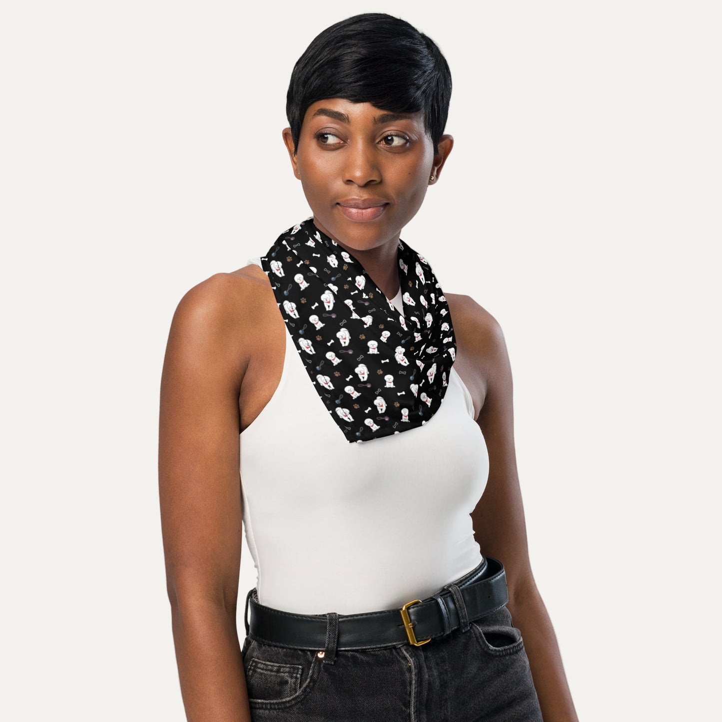 Woman wearing black Bichon Frise patterned bandana around neck – Stylish dog lover accessory