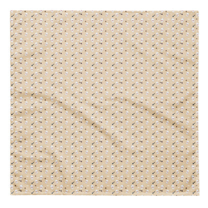 Flat lay of beige Bichon Frise patterned bandana with playful dog, paw, and bone design
