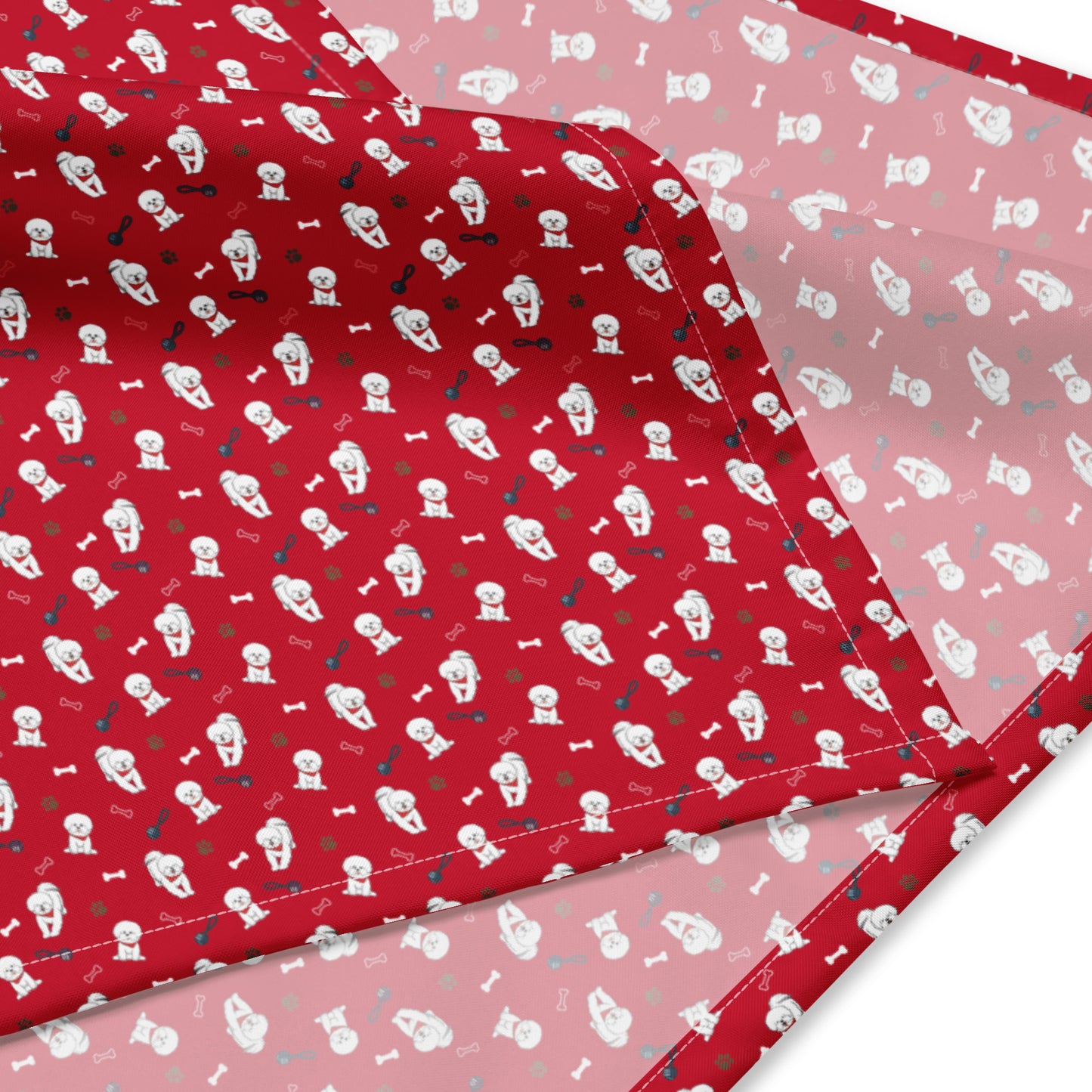 Close-up of red Bichon Frise bandana fabric with cute dog, paw print and bone pattern – Fun Factory Frise accessory
