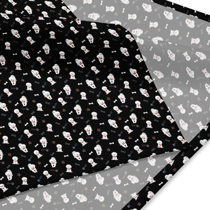 Close-up of black Bichon Frise patterned bandana fabric with playful dog, paw, and bone design