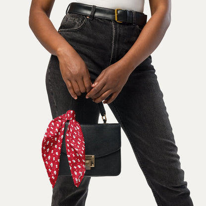 Red Bichon Frise bandana tied to black handbag – stylish dog lover accessory by Fun Factory Frise