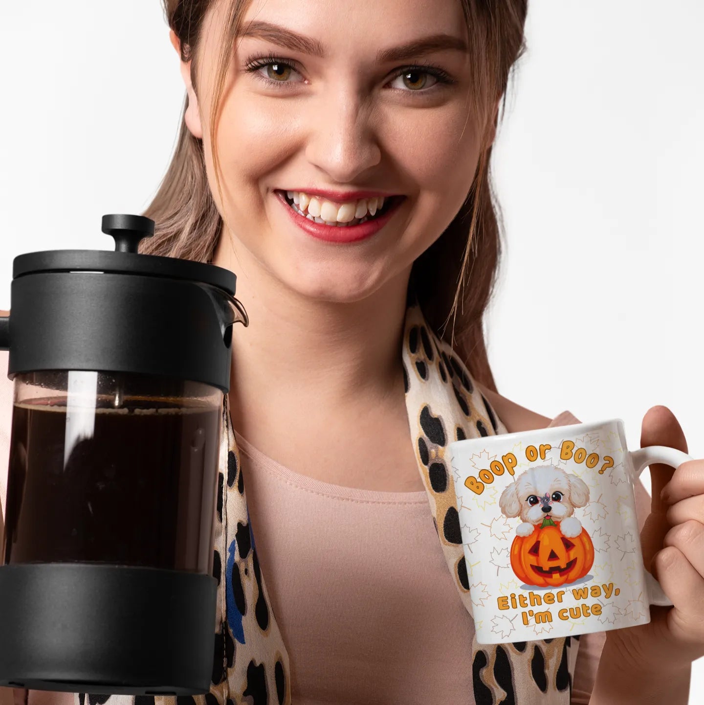 Woman holding a French press and a mug with a dog design on a white background