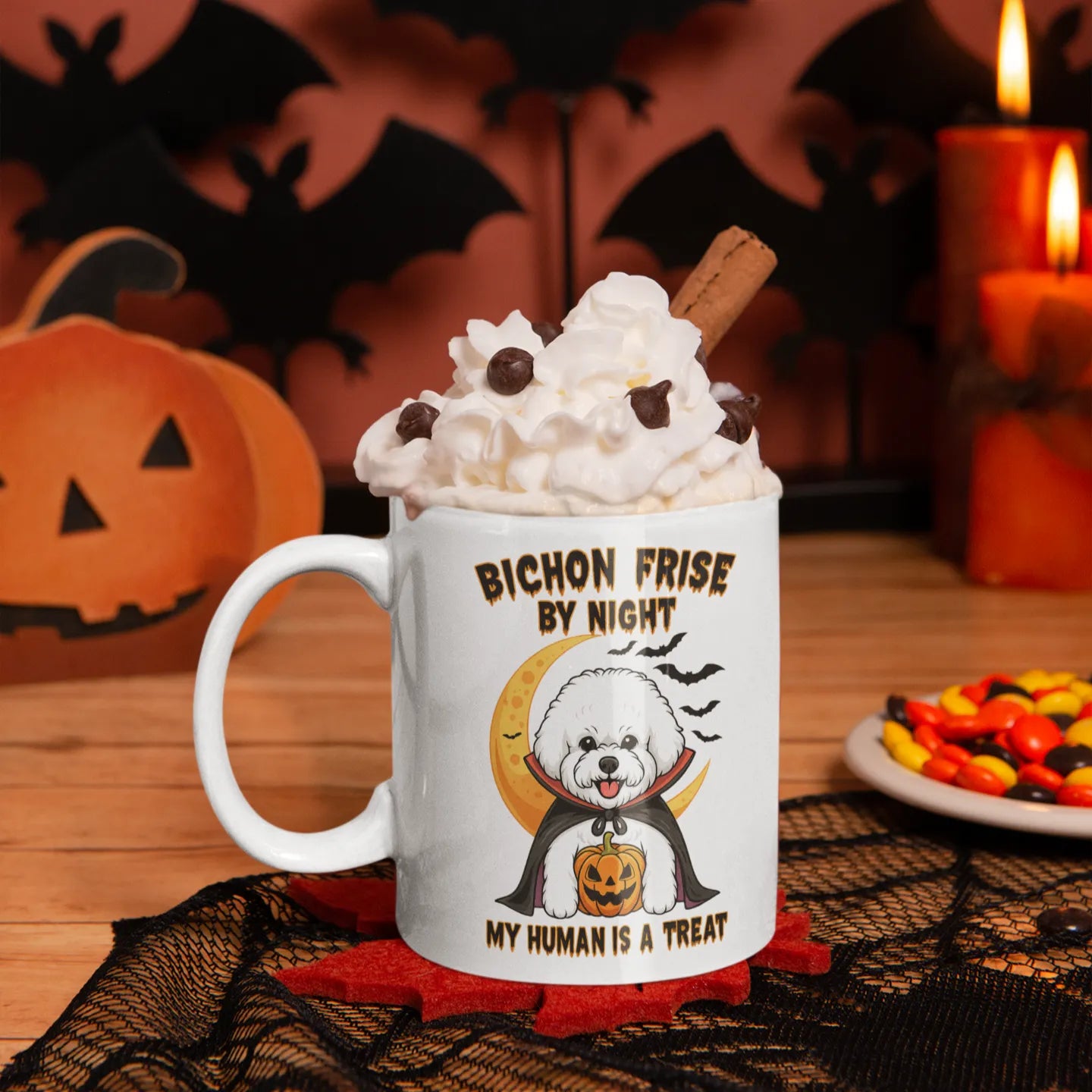 Halloween-themed Bichon Frise mug with whipped cream topping, surrounded by pumpkins and spooky bats