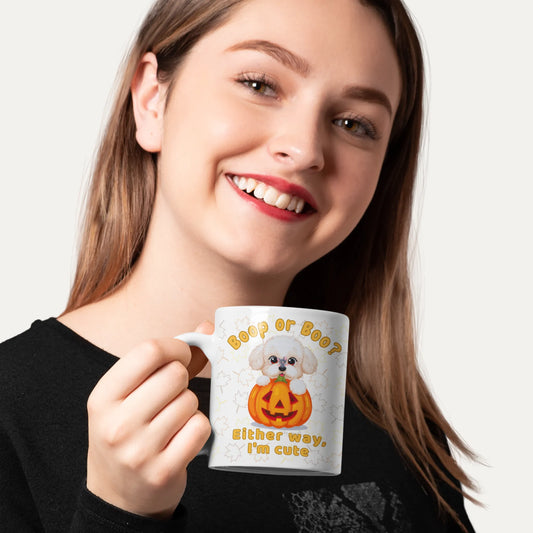 Woman holding a mug with a Halloween-themed design featuring a dog and pumpkin.