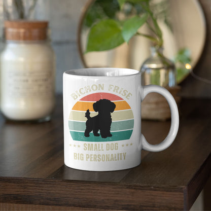 White ceramic mug with retro design featuring a Bichon Frise silhouette and the text Small Dog Big Personality, placed on a wooden table with cozy decor