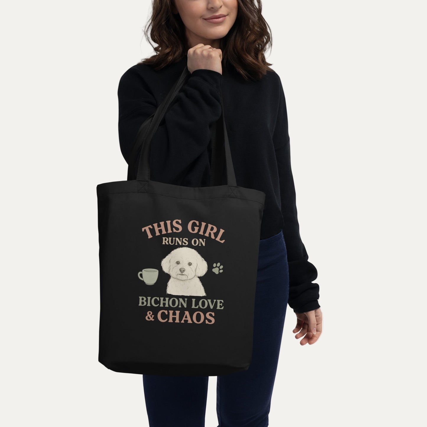 Black tote bag with Bichon Frise illustration and funny quote This Girl Runs on Bichon Love & Chaos
