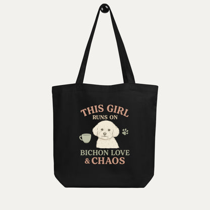 Black eco tote bag with Bichon Frise dog illustration and funny quote This Girl Runs on Bichon Love & Chaos