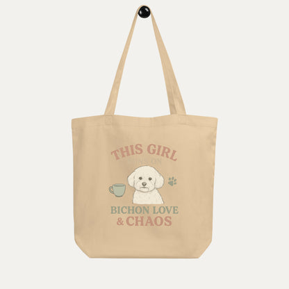 Beige eco tote bag with funny Bichon Frise dog illustration and text This Girl Runs on Bichon Love & Chaos