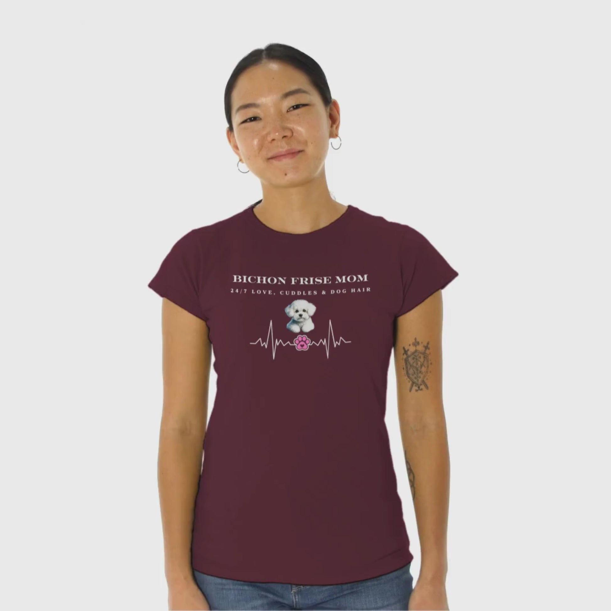 Promotional video of a smiling woman wearing a black 'Bichon Frise Mom – 24/7 Love, Cuddles & Dog Hair' T-shirt with heartbeat design, perfect for Bichon Frise dog lovers