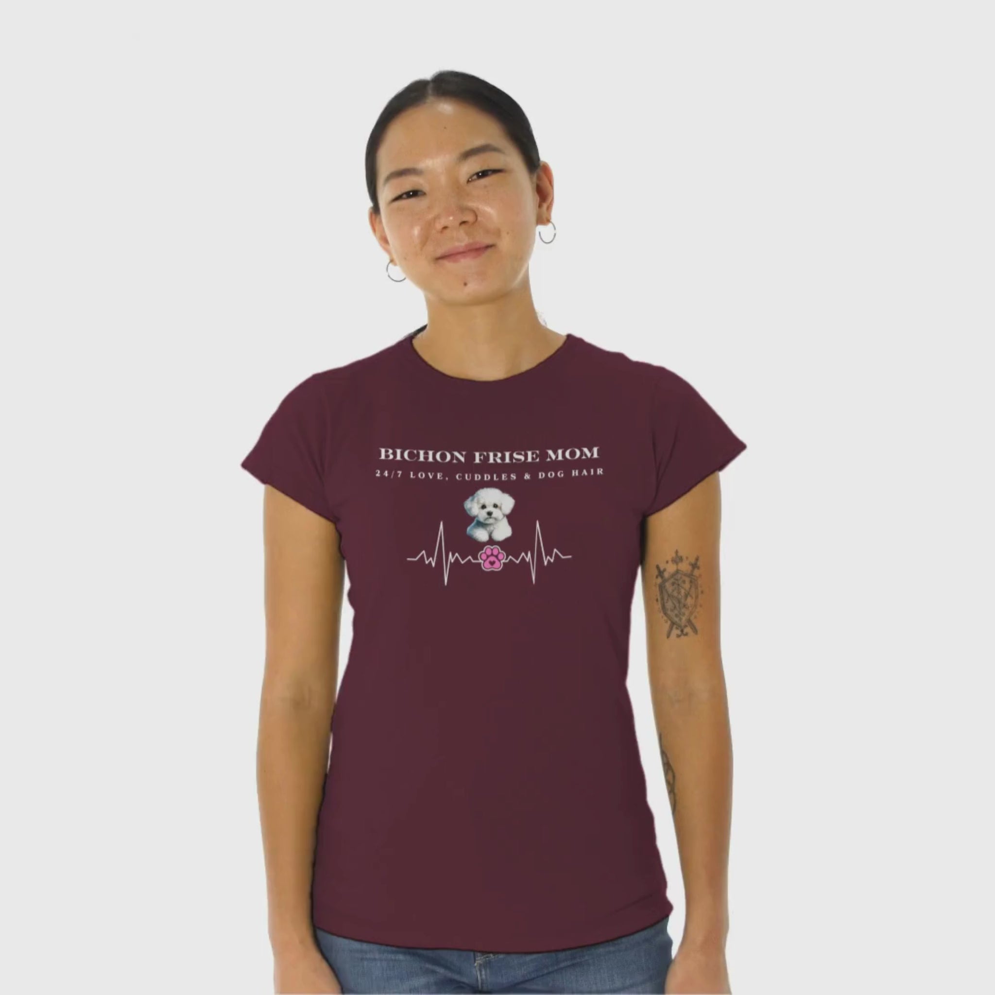 Promotional video of a smiling woman wearing a black 'Bichon Frise Mom – 24/7 Love, Cuddles & Dog Hair' T-shirt with heartbeat design, perfect for Bichon Frise dog lovers