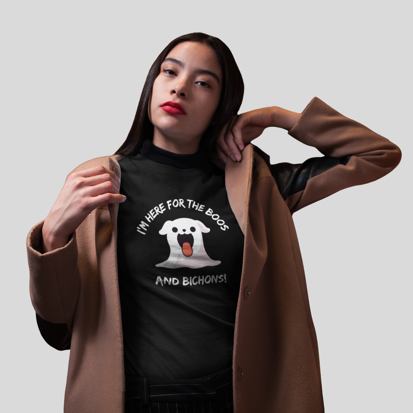 Spooky Halloween video of a woman in gothic costume holding a crystal ball, wearing a funny ghost-themed T-shirt with a Bichon Frise and the phrase “I’m here for the Boos and Bichons!