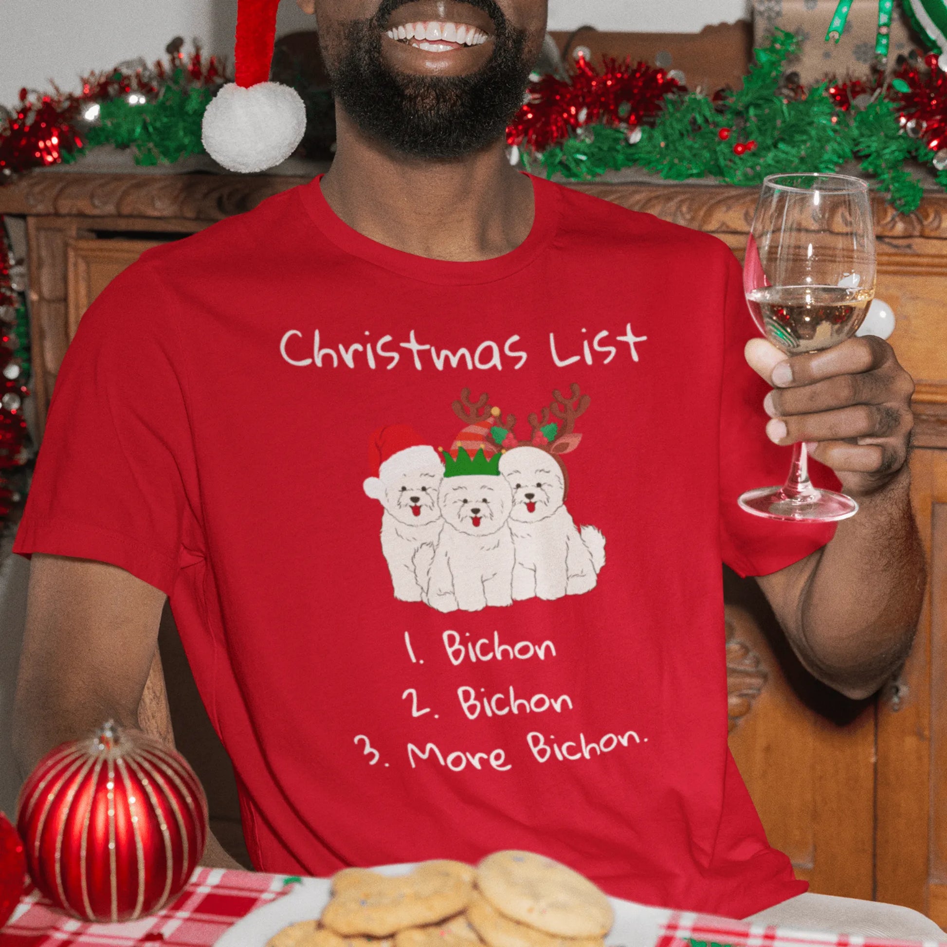 "Funny Christmas-themed unisex t-shirt with text 'Christmas List: 1. Bichon 2. Bichon 3. More Bichon' – perfect holiday gift for dog lovers, especially Bichon Frisé owners; cheerful and unique dog print shirt for men and women."