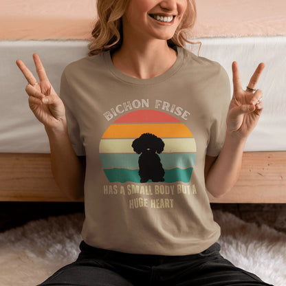 "Colorful unisex T-shirt featuring a cute black dog illustration with the quote 'Has a small body but a huge heart' – perfect for dog lovers, including but not limited to Bichon Frise fans; ideal for both men and women."