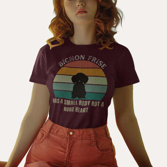 "Colorful unisex T-shirt featuring a cute black dog illustration with the quote 'Has a small body but a huge heart' – perfect for dog lovers, including but not limited to Bichon Frise fans; ideal for both men and women."