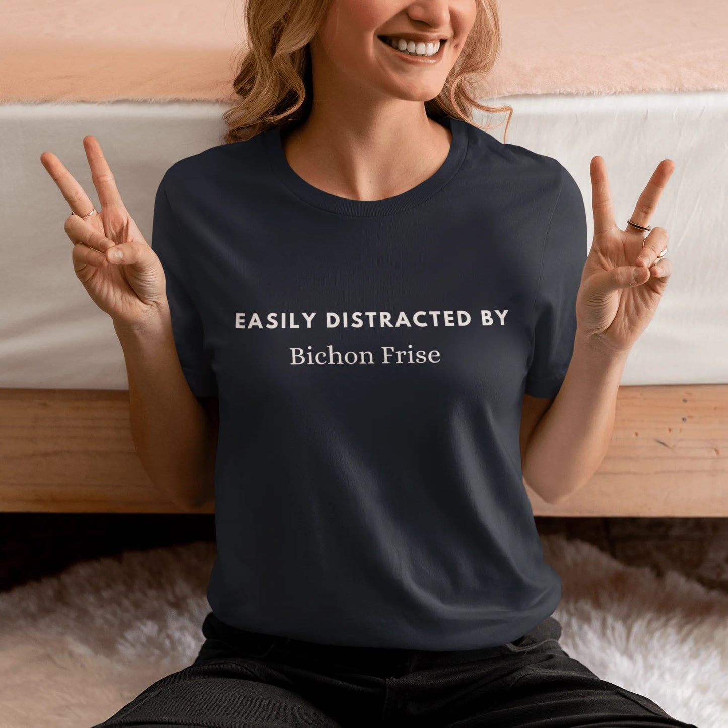 Unisex white tee with “Easily distracted by Bichon Frise” text — perfect for proud Bichon Frise dog lovers who want a unique, stylish look.