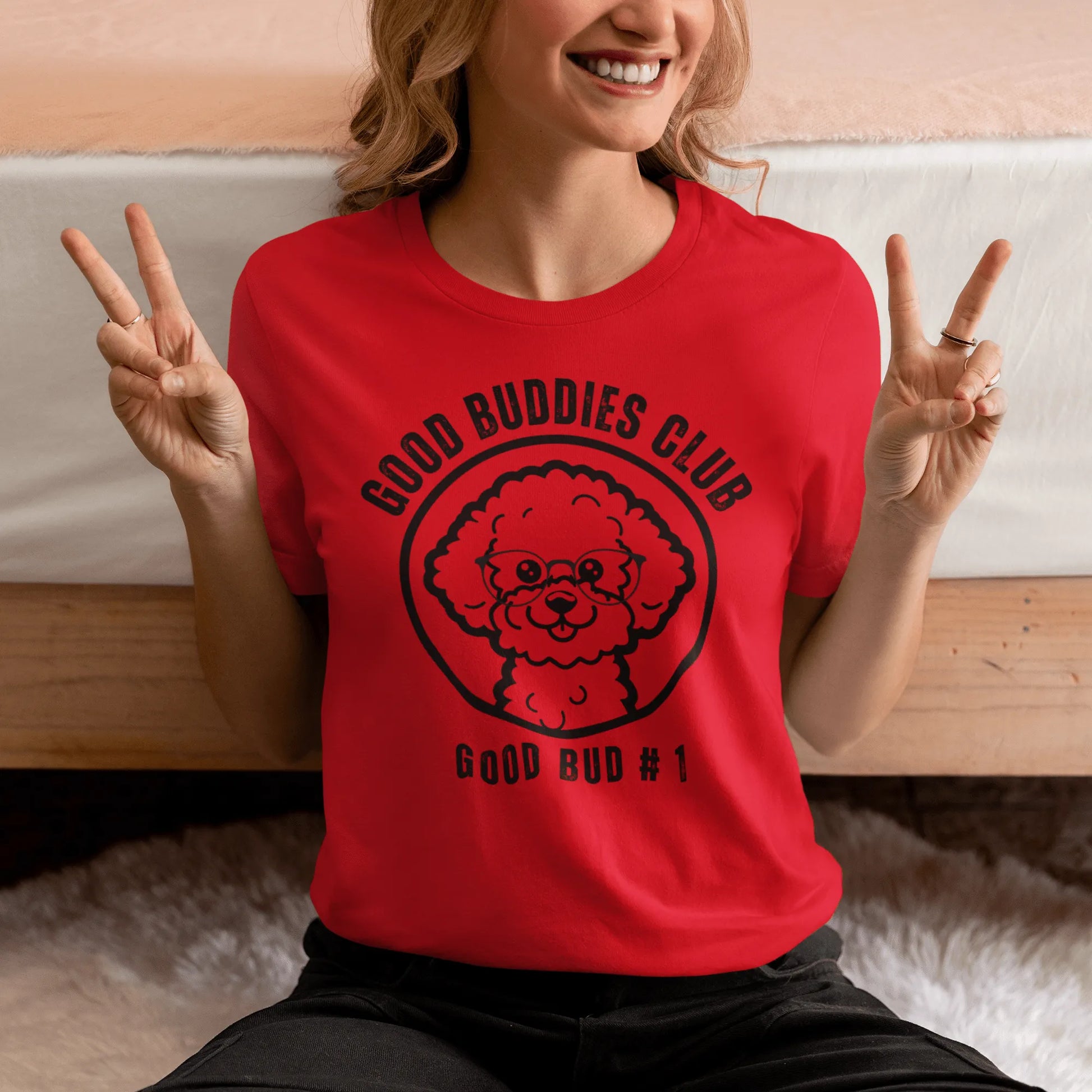 "Good Buddies Club unisex black T-shirt featuring a cheerful, happy Bichon Frise dog illustration wearing glasses, perfect for dog owners and dog lovers. Fun and unique dog-themed shirt design, ideal not only for Bichon Frise fans but all dog enthusiasts."