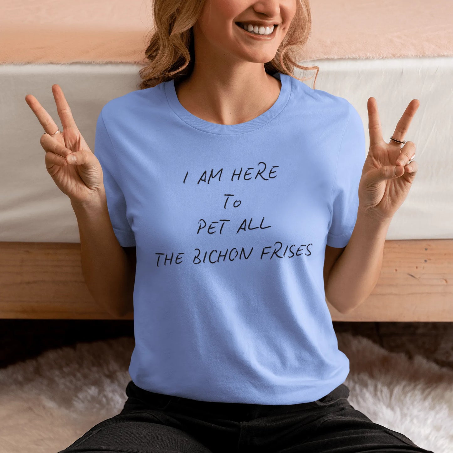 Black unisex t-shirt with the funny quote "I Am Here To Pet All The Bichon Frises" – perfect gift for Bichon Frise dog lovers, minimalist design with playful vibe.
